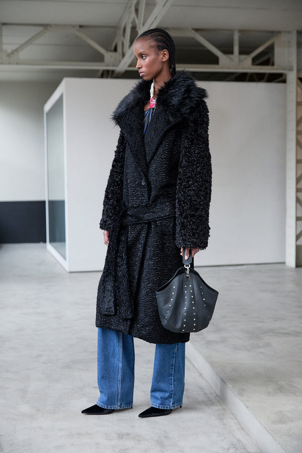 SMALL LEATHER BUCKET BAG W/ SWIVEL & STUD DETAILS