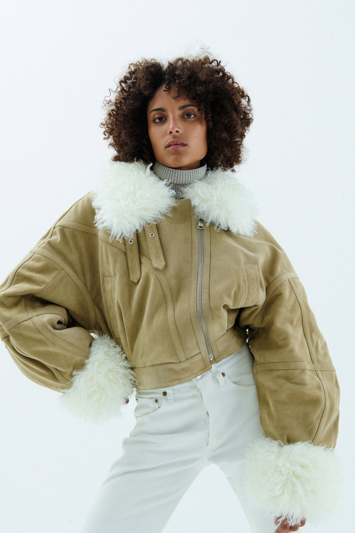 Model wearing Vaillant oversized suede aviator bomber jacket styled as Parisian luxury outerwear